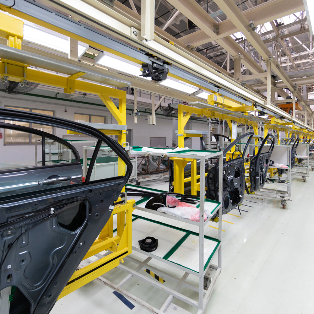 car door on conveyor. Robotic equipment makes Assembly of car. Modern car Assembly at factory